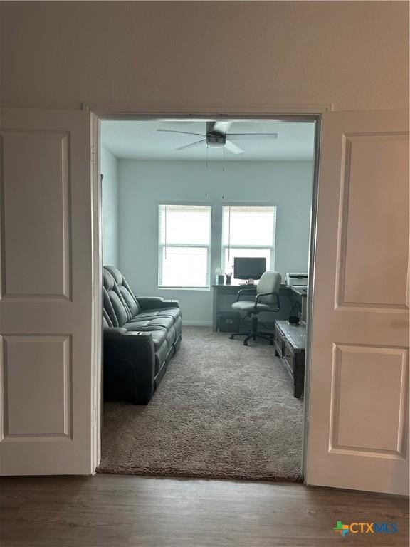 interior space with hardwood / wood-style floors and ceiling fan