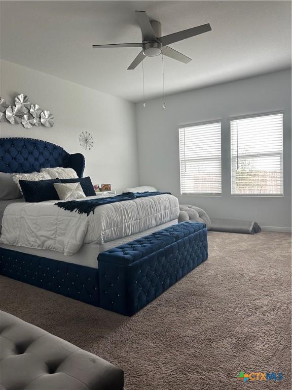 bedroom featuring ceiling fan and carpet flooring