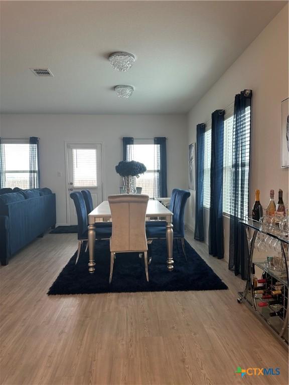 dining area with wood-type flooring