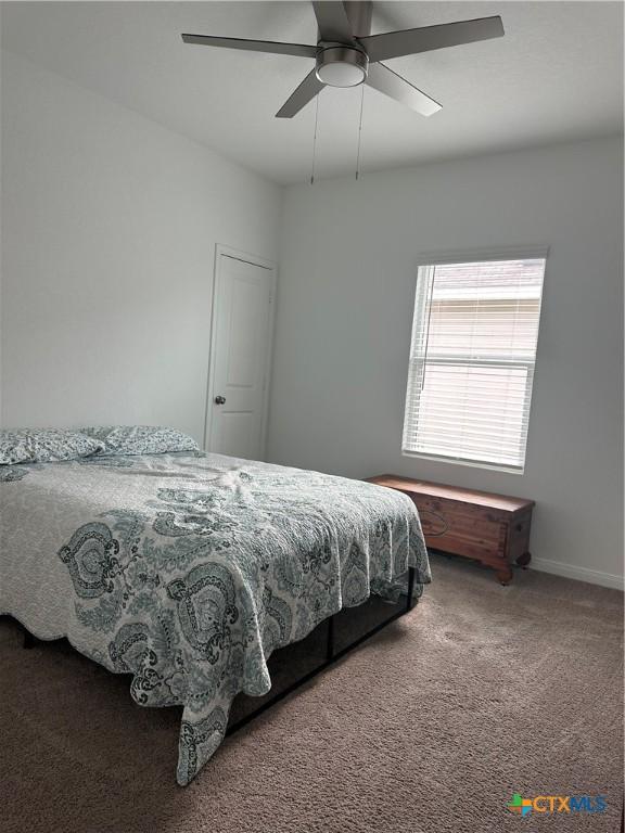 carpeted bedroom with ceiling fan