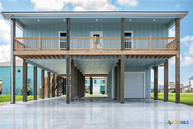 exterior space with a garage and a carport