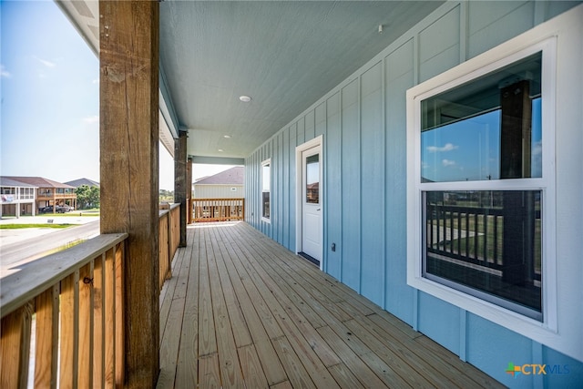 wooden terrace with a porch