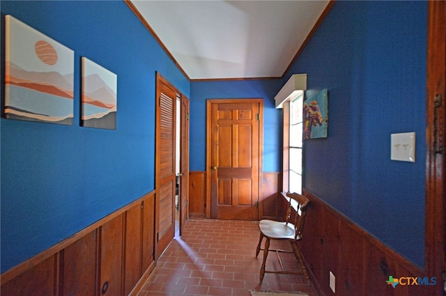 929 E Cedar St, Seguin, TX 78155 - hallway featuring wainscoting, brick flooring, and wooden walls