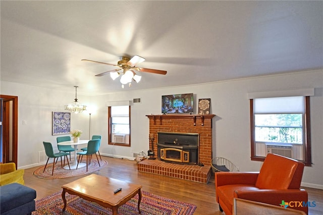 929 E Cedar St, Seguin, TX 78155 - living area with wood finished floors, ceiling fan, cooling unit, and healthy amount of natural light