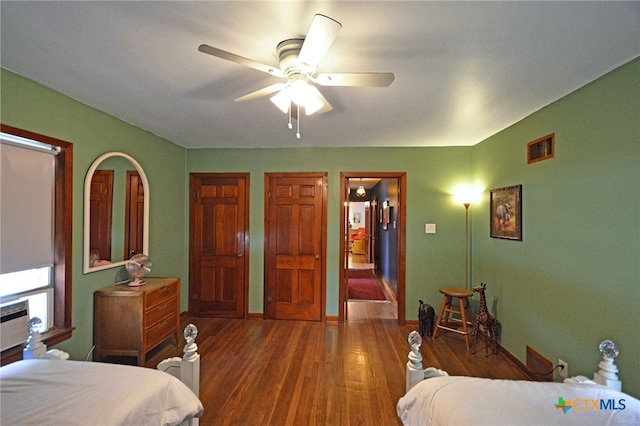 929 E Cedar St, Seguin, TX 78155 - bedroom featuring wood finished floors and a ceiling fan