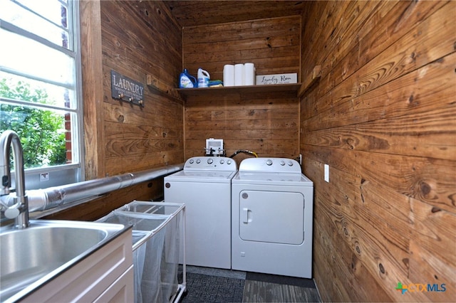 929 E Cedar St, Seguin, TX 78155 - washroom featuring independent washer and dryer and wood walls