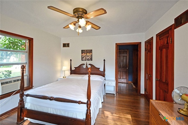 929 E Cedar St, Seguin, TX 78155 - bedroom featuring dark wood finished floors and a ceiling fan