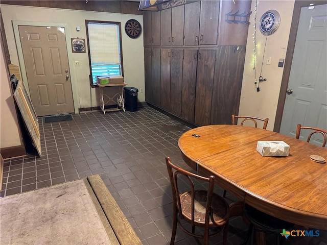 308 Avenue E Ave E, Victoria, TX 77901 - dining area with dark tile patterned flooring and baseboards