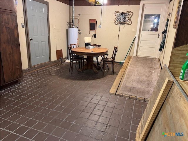 308 Avenue E Ave E, Victoria, TX 77901 - dining area featuring water heater and dark tile patterned floors