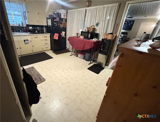 308 Avenue E Ave E, Victoria, TX 77901 - kitchen with tile counters, freestanding refrigerator, and decorative backsplash