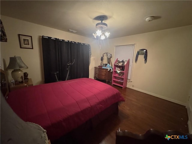 308 Avenue E Ave E, Victoria, TX 77901 - bedroom with wood finished floors and baseboards