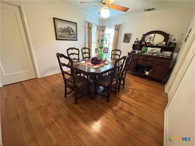 308 Avenue E Ave E, Victoria, TX 77901 - dining area featuring crown molding, wood finished floors, and a ceiling fan
