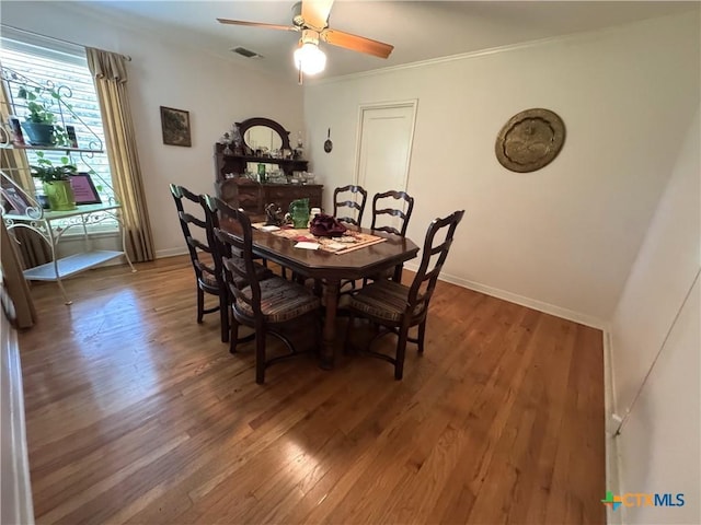 308 Avenue E Ave E, Victoria, TX 77901 - dining space with wood finished floors, ornamental molding, and a ceiling fan
