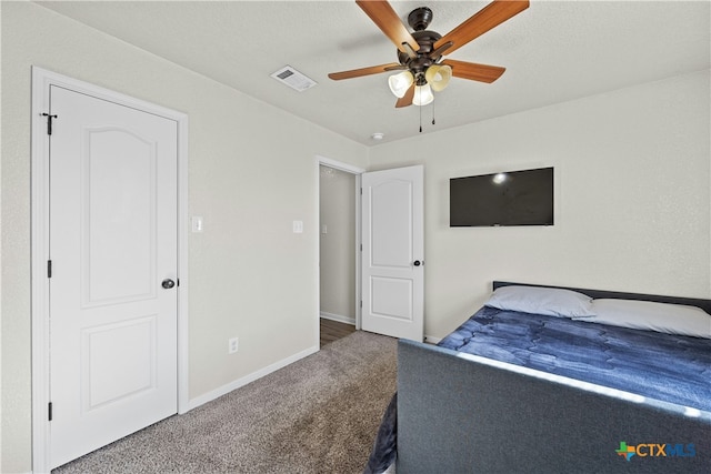 bedroom with ceiling fan and carpet floors