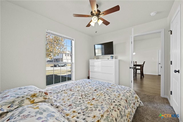 carpeted bedroom featuring ceiling fan