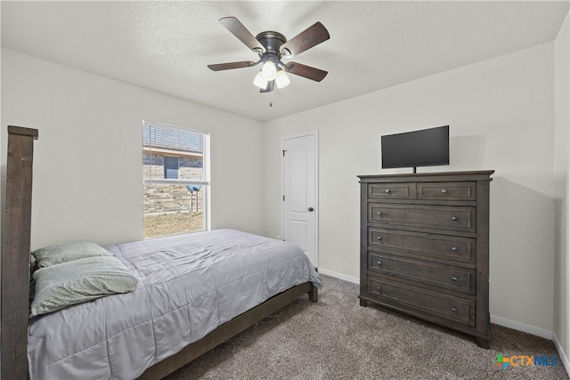 bedroom with carpet flooring, a textured ceiling, and ceiling fan