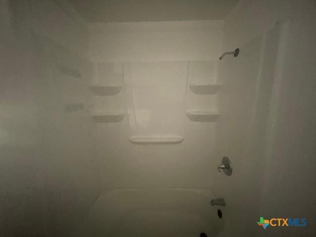 details featuring tub / shower combination