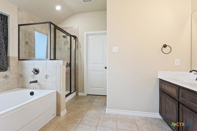 4004 Brookside Dr, Killeen, TX 76542 - bathroom featuring a garden tub, a stall shower, tile patterned floors, vanity, and vaulted ceiling