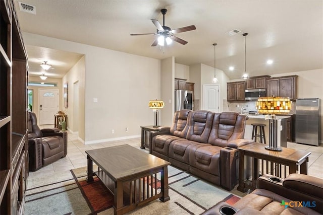 4004 Brookside Dr, Killeen, TX 76542 - living room featuring ceiling fan, light tile patterned floors, and vaulted ceiling