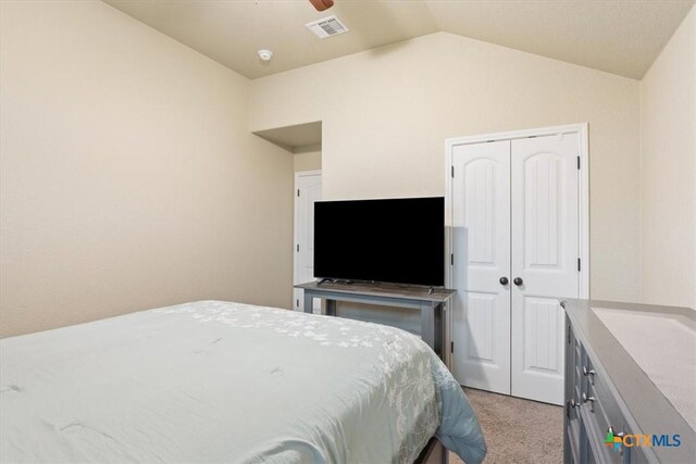 4004 Brookside Dr, Killeen, TX 76542 - bedroom featuring light colored carpet, vaulted ceiling, a closet, and ceiling fan