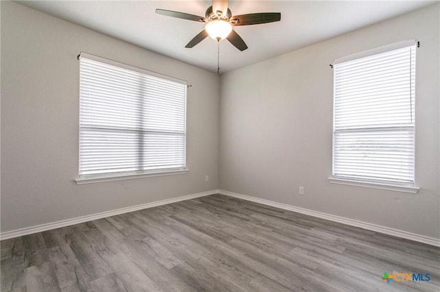 916 Stone Rd, Temple, TX 76501 - empty room featuring wood finished floors, ceiling fan, and baseboards