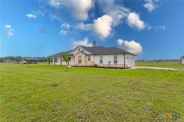 916 Stone Rd, Temple, TX 76501 - view of front of house with a chimney, driveway, a front lawn, and an attached garage