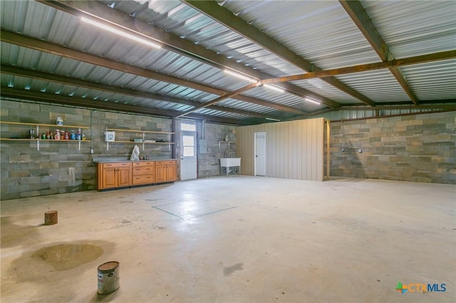 916 Stone Rd, Temple, TX 76501 - garage with concrete block wall and a sink