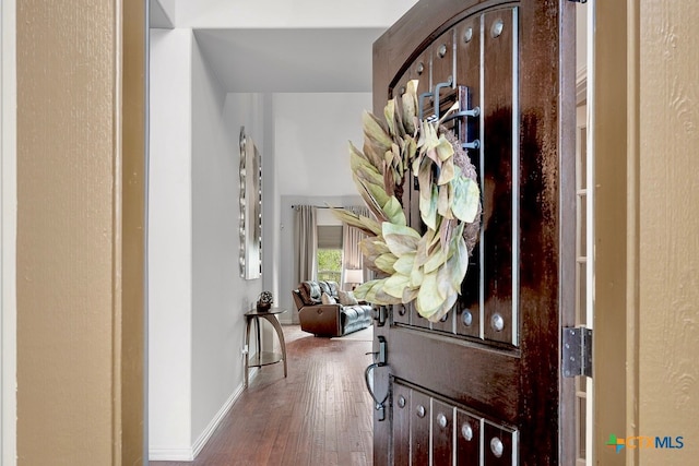 entryway with wood-type flooring