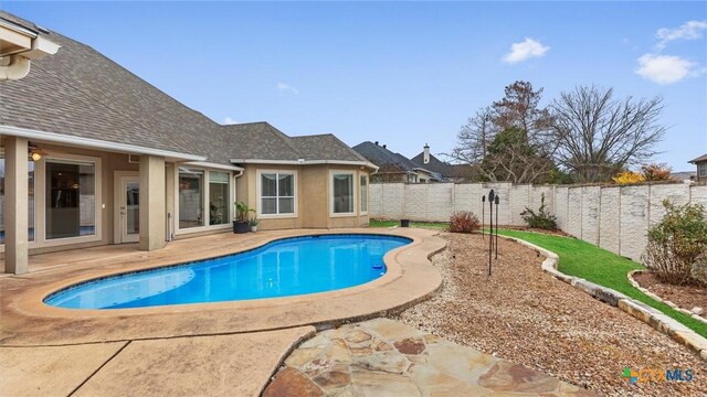 view of swimming pool featuring a patio area