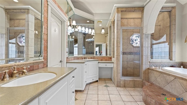 bathroom with vanity, independent shower and bath, and tile patterned flooring