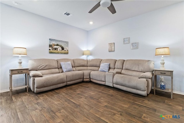 living area with visible vents, ceiling fan, baseboards, and wood finished floors