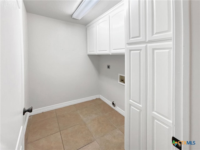 laundry area featuring washer hookup, light tile patterned floors, cabinets, and hookup for an electric dryer