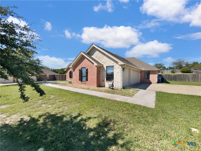 view of front of property with a front lawn and a garage