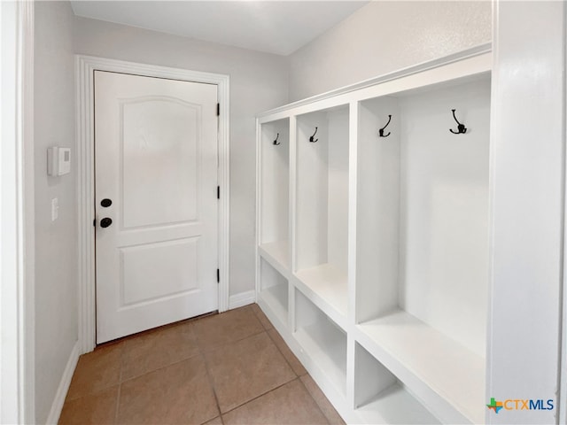 mudroom with light tile patterned floors