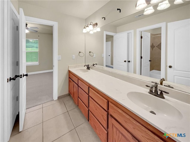 bathroom featuring tile patterned flooring, vanity, and ceiling fan