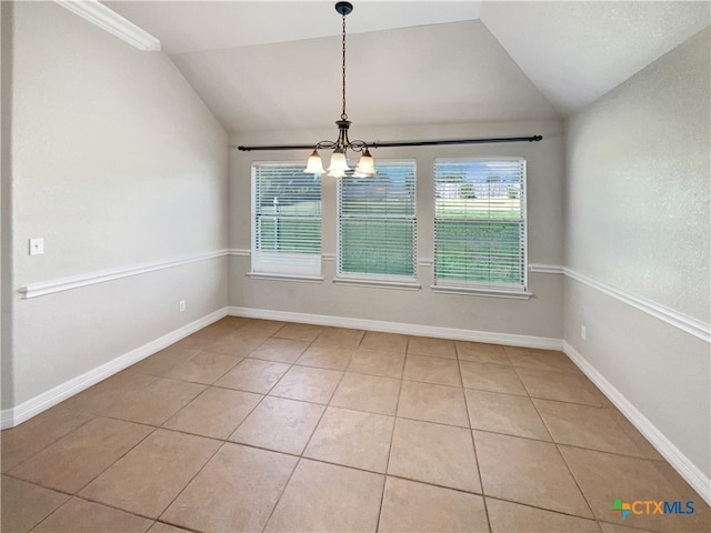 unfurnished dining area with tile patterned flooring, an inviting chandelier, and vaulted ceiling