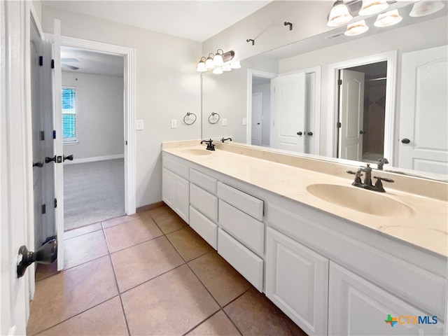 bathroom featuring tile patterned flooring and vanity