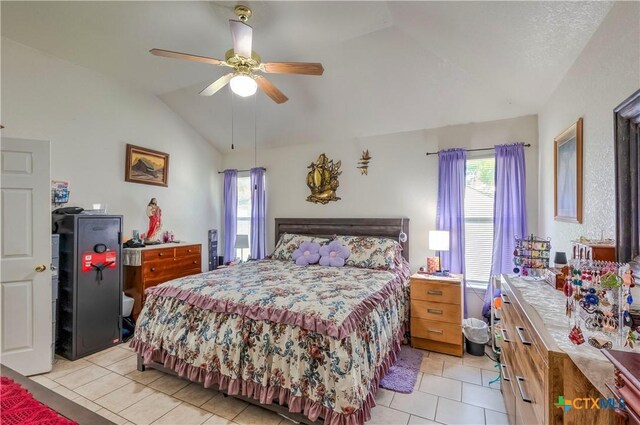 3302 Southhill Dr, Killeen, TX 76549 - bedroom featuring vaulted ceiling, light tile patterned floors, and a ceiling fan