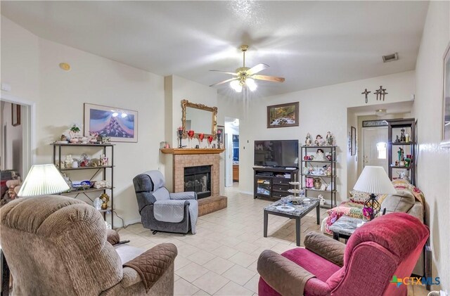 3302 Southhill Dr, Killeen, TX 76549 - living area featuring a fireplace, a ceiling fan, light tile patterned floors, and baseboards