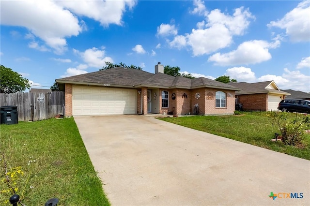 3302 Southhill Dr, Killeen, TX 76549 - single story home featuring a garage, brick siding, concrete driveway, and a chimney
