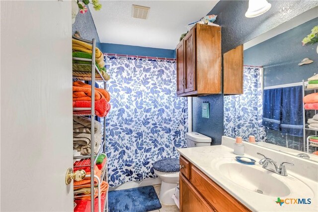 3302 Southhill Dr, Killeen, TX 76549 - bathroom with toilet, vanity, and curtained shower