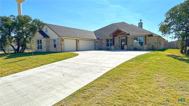 view of front of house featuring a garage and a front lawn