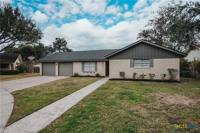 single story home featuring a garage, central AC, and a front lawn