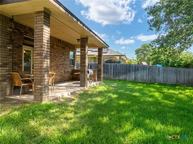 view of yard with a patio area