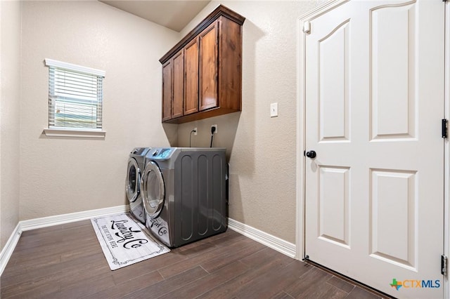 laundry area featuring cabinets and separate washer and dryer