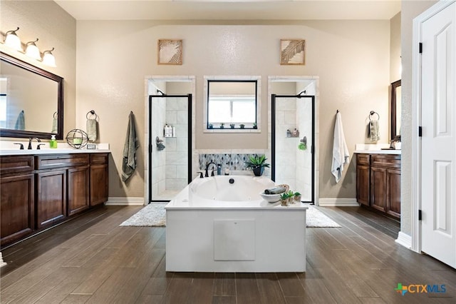 bathroom with vanity and plus walk in shower