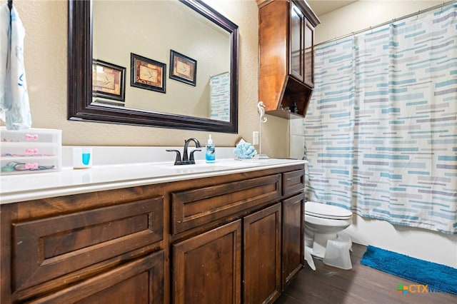 full bathroom featuring shower / tub combo with curtain, vanity, toilet, and wood-type flooring