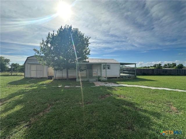 449 Rosehall Ln, Temple, TX 76504 - rear view of house with a storage unit and a metal roof