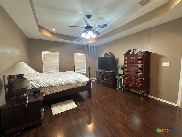 449 Rosehall Ln, Temple, TX 76504 - bedroom with a tray ceiling, wood finished floors, a ceiling fan, and recessed lighting
