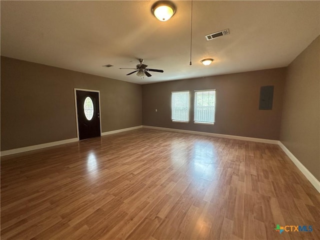 449 Rosehall Ln, Temple, TX 76504 - empty room featuring plenty of natural light, a ceiling fan, electric panel, and wood finished floors
